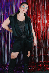 Women's vintage 1980's Stash label sleeveless mini length black dress with bronze metallic details.