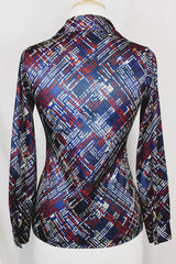 Women's vintage 1970's long sleeve button up blouse with a dagger collar in a navy blue color and all over abstract print.
