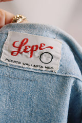 Men's or women's vintage 1970's Lepe, Puerto Vallarta, Mexico label long sleeve light blue denim wash chambray button up shirt with colored embroidery in the front and back.