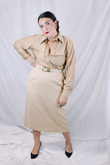 Women's or mens' vintage 1970's long sleeve button up shirt in a slinky nylon tan colored material. White buttons and dagger collar.