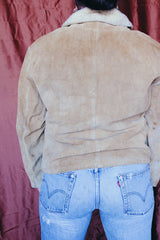 Women's or men's vintage 1950's Alaska Sleeping Bag Co., Portland, Oregon label long sleeve tan colored suede jacket with popper buttons and cream shearling liner.