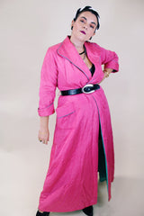 Women's vintage 1950's Lyn Delle label long sleeve long length bright pink quilted robe jacket with teal colored trim.