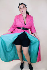 Women's vintage 1950's Lyn Delle label long sleeve long length bright pink quilted robe jacket with teal colored trim.