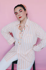 Women's or men's vintage 1970's Sears The Men's Store, Made in Japan label long sleeve button up shirt in white with all over orange vertical stripes.