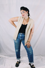 Men's or women's vintage 1970's Norsewear, Made in New Zealand label sleeveless zip up wool material vest in an oatmeal cream color. Ribbed texture all over.
