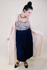 Women's vintage long sleeve long length pale pink sheer robe with an open tie front and lace trim. Has small shoulder pads and ties on cuffs.