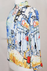 Women's vintage 1980's Michael Leu label long sleeve button up blouse with small collar, white buttons, and all over novelty print in a silk material.