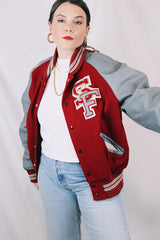 Men's or women's vintage 1980's DeLong, Made in USA label long sleeve dark red and grey varsity letterman jacket with patches and pins. Wool and leather material.
