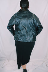 Women's vintage 1980's long sleeve black leather lightweight jacket. Dolman fit and snap buttons.