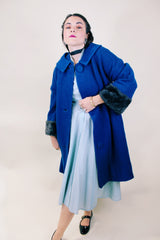 Women's vintage 1960's Jack Bloom California label long sleeve royal blue color coat. Ankle length with grey fur trim around collar and cuffs.