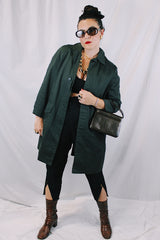 Men's or women's vintage 1960's Brent Prep Sold Exclusively by Montgomery Ward long sleeve long length cotton material lightweight trench coat in a dark green and all over subtle plaid print.