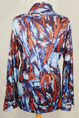 Men's vintage 1970's Joel label long sleeve button up shirt with all over red, blue, and navy abstract print in slinky polyester material.