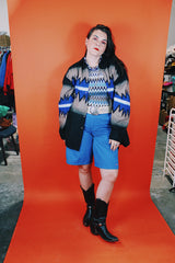 Men's vintage 1980's Express Rider label long sleeve button up shirt with a black, blue, and beige Western style print.