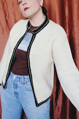 Women's vintage 1960's Brentwood Sportswear label long sleeve zip up cardigan in a waffle knit cream color. Has black and tan trim throughout.