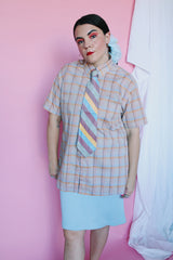 Men's or women's vintage 1970's The Fox, JCPenney label short sleeve button up shirt in yellow, grey, blue, and mauve all over plaid print. Tortoise colored buttons.