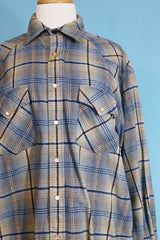 Men's vintage 1970's Pendleton label long sleeve button up western style shirt in a wool material and blue colors. Pearl silver snapper buttons.