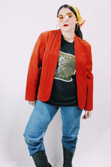 Women's vintage 1970's Deerskin Quality Leathers long sleeve open front lightweight suede leather jacket in a vibrant burnt orange color.