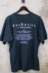 Women's or men's vintage 1997 Gildan Heavyweight, Made in Canada label short sleeve black The Kinks' Ray Davies The Storyteller tour tee with colored graphic and text on front and back.