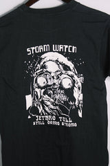 Women's or men's vintage 1970's Made in USA label short sleeve black colored Jethro Tull tour tee with graphic on front and back in white in cotton material.