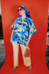 Women's vintage 1980's Made in Hawaii short sleeve wide cape blouse in all over blue Hawaiian print.