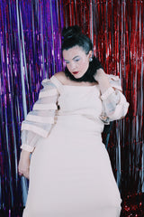 Women's vintage 1980's Made in USA label long sleeve mini length light tan colored dress.