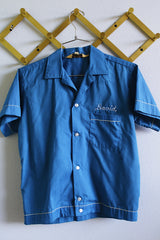 Women's or men's vintage 1960's Hilton, Made in USA label short sleeve blue button up bowling shirt with white trim and white embroidery.