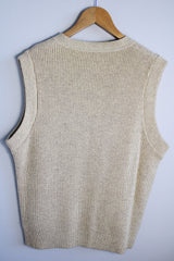 Men's or women's vintage 1970's Norsewear, Made in New Zealand label sleeveless zip up wool material vest in an oatmeal cream color. Ribbed texture all over.