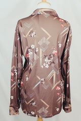 Men's vintage 1970's Montgomery Ward label long sleeve light brown colored button up shirt with all over floral print.