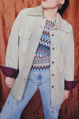 Women's or men's vintage 1970's Styled by William Barry label long sleeve grey colored suede jacket with maroon colored liner and popper buttons.