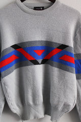 Men's or women's vintage 1980's Demetre, Made in USA label long sleeve pullover crew neck sweater in light grey with colored pattern across chest in wool material.