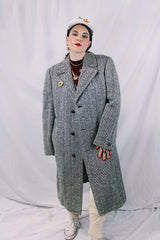 Men's vintage 1970's Metropole Monarch, Man's Shop San Francisco label long length long sleeve black and cream wool chevron trench coat with brown wood buttons.