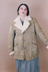 Men's or women's vintage 1970's Skinny's Hideout, Knight Tailors LTD. Australasia, Made in New Zealand label size large long sleeve tan brown suede medium length coat with cream shearling liner.