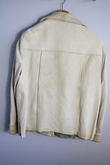 Women's vintage 1960's Custom Made Genuine Native Deerskin label long sleeve cream colored leather jacket. Fully lined, side pockets, and leather covered buttons.