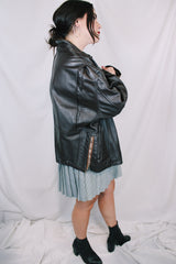 Men's or women's vintage 1980's Kirk's Suede Life label long sleeve oversized dark chocolate brown leather bomber jacket with zipper front closure.