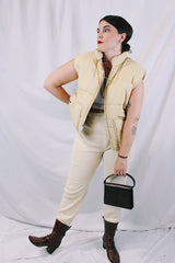 Women's or men's vintage 1970's A & M Industries, Seattle, Washington label sleeveless zip up puffer vest. Cream colored exterior, brown colored interior.