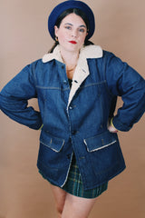 Men's or women's vintage 1970's Montgomery Ward label size medium long sleeve dark wash denim jacket with cream colored shearling liner.