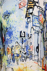 Women's vintage 1980's Michael Leu label long sleeve button up blouse with small collar, white buttons, and all over novelty print in a silk material.