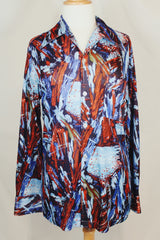 Men's vintage 1970's Joel label long sleeve button up shirt with all over red, blue, and navy abstract print in slinky polyester material.