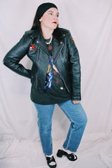 Men's or women's vintage 1970's Harley-Davidson label long sleeve black leather motorcycle jacket with silver hardware and patches.