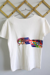 Women's vintage 1980's Crazy Shirt Hawaii, Made in USA label short sleeve white t-shirt with graphic from 1983 Honolulu Marathon on front and back.