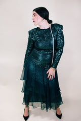Women's vintage 1980's long sleeve ankle length dress with all over sequins and a tiered ruffles skirt. Forest green color.