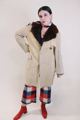 Men's or women's vintage 1970's tan suede long length long arm jacket with brown fur trim around collar. Matching suede belt.