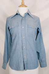 Women's vintage 1970's long sleeve light blue chambray denim shirt with large strawberry print on the back.