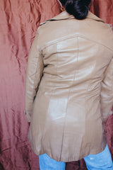 Women's vintage 1970's Nordstrom label long length long sleeve tan brown colored double breasted leather trench coat.