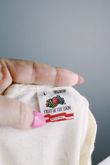 Women's or men's vintage 1988 Fruit of the Loom, Made in USA label short sleeve white 1988 The Robert Cray Band tour tee with graphic on front and back in cotton material.