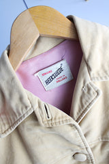 Women's vintage 1960's Union Made, Genuine Heeksuede Made in Holland label long sleeve short length tan colored suede button up lightweight jacket. Two front pockets and pink liner.