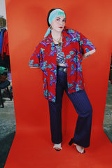 Men's vintage 1970's Michael Gerald Ltd., Hand Screened short sleeve button up shirt in an all over Hawaiian print with parrots.