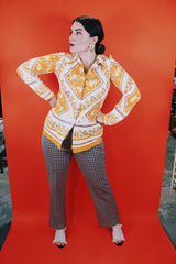 Women's vintage 1970's long sleeve button up blouse with dagger collar, darted bust, and big round clear buttons.