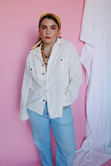 Men's or women's vintage 1970's Montgomery Ward label long sleeve cream colored cotton material button up shirt. Brown buttons and two chest pockets.