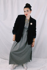 Women's vintage 1970's The Chaus Woman label long sleeve black velvet blazer in a cotton and rayon blend material. One button closure, two pockets, and fully lined.